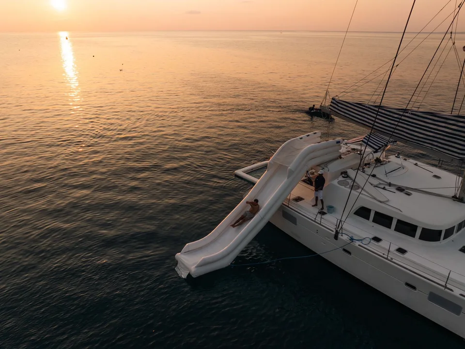 Coco Paradise, Yacht at sunset with water slide